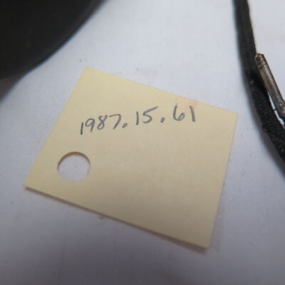 Number tag for headphones: Origsize: 7" (h) x 9" (w) x 3"; Origformat: Artifact