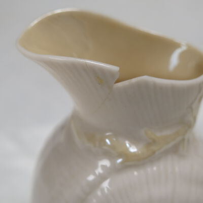 Chip on rim of pitcher.: Origsize: 3.5" (h) x 3.25" (w); Origformat: Artifact