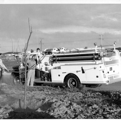 Kenneth Howell and Mike Holdredge Watering Trees with a Fire Truck