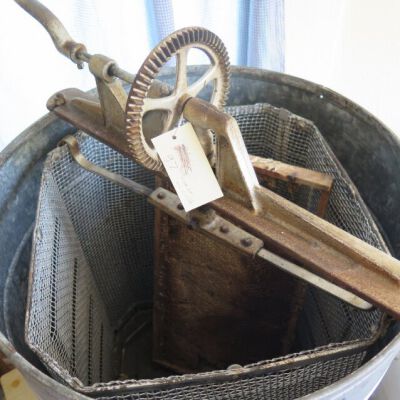 Inside of honey extractor.: Origsize: 32" (h) x 18.5" (dia; Origformat: Artifact