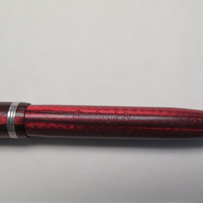 Close up of text on pen.: Origsize: 5" (l) x 0.25" (dia); Origformat: Artifact
