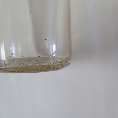 Text on milk bottle.: Origsize: 7" (h) x 3" (dia); Origformat: Artifact