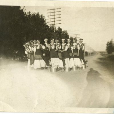 Frances Cron, Ellenor Brown, and Blanche Brown Posing with Others in Matching Dresses