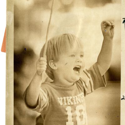 "Flag Waver" - Little boy holding flag, cheering
