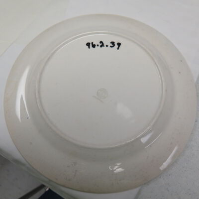 Bottom of plate.: Origsize: 1" (h) x 9.25" (dia); Origformat: Artifact
