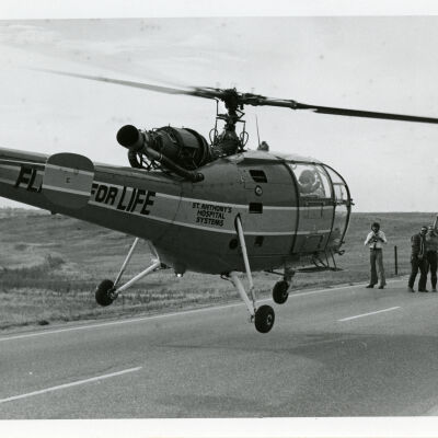 Flight for Life helicopter landing at a car accident, Highway 287