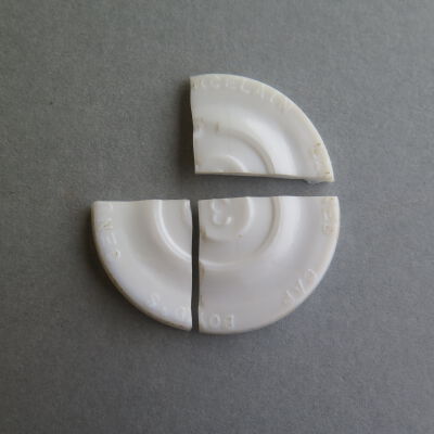 Close up of text on lid.: Origsize: .5" (h) x 6.5" (diam; Origformat: Artifact