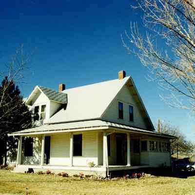 House on Brunner property with a few trees