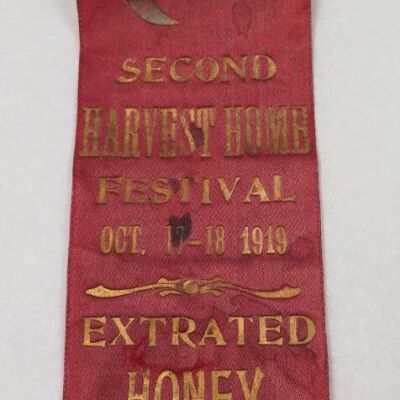 Front of ribbon: Origsize: 6" (l) x 2" (w); Origformat: Artifact