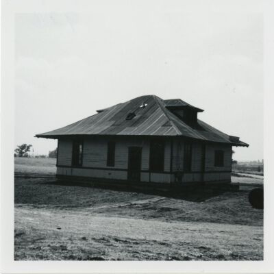 Back of the Broomfield train depot at its new location, 1976: Origsize: 3.5" x 3.5"; Origformat: Print-Photographic; Resolution: 1500dpi