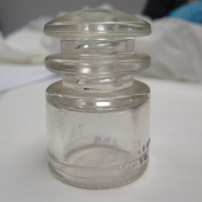 SIde of glass insulator.: Origsize: 3" (h) x 2.5" (dia); Origformat: Artifact