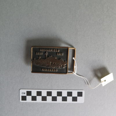 Front of belt buckle.: Origsize: 2.25" (h) x 3" (w); Origformat: Artifact