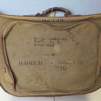 Front of suitcase: Origsize: 6" (h) x 24" (w) x 1; Origformat: Artifact