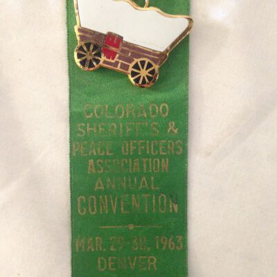 Close up of front of ribbon.: Origsize: 6"(H) x 1.25"(W); Origformat: Artifact