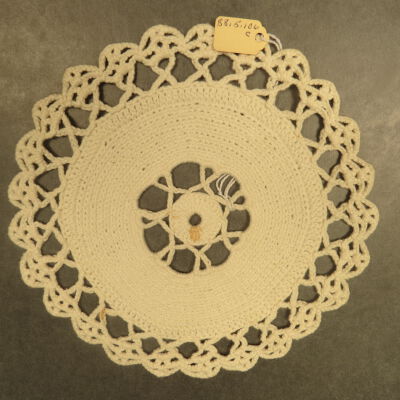 One side of doily.: Origsize: 6.5"; Origformat: Artifact