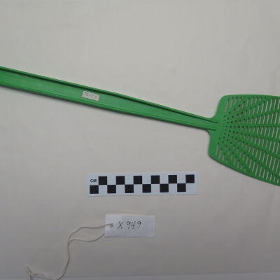Back of fly swatter.: Origsize: 4" (w) x 15.25" (l); Origformat: Artifact