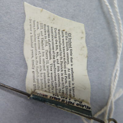 Close up of text on back of flag.: Origsize: 2.25" (h) x 1.25"  (; Origformat: Artifact