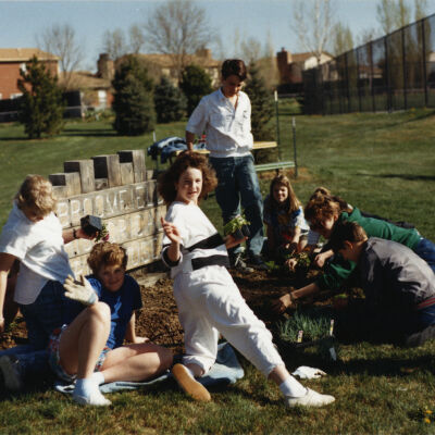 Kids Planting Near the Broomfield Historical Depot Sign and Museum