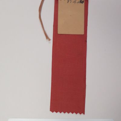 Back of ribbon: Origsize: 1.5" (w) x 6.5" (l); Origformat: Artifact