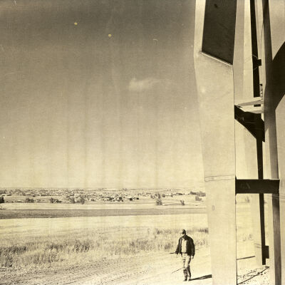 Worker walking by Broomfield water storage structure