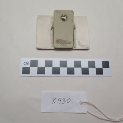 Back of nametag.: Origsize: 3" (w) x 2.25" (l); Origformat: Artifact