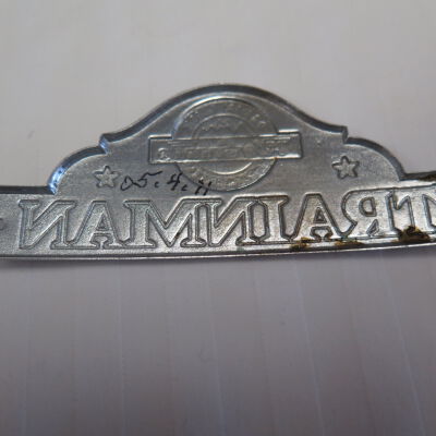 Back of badge.: Origsize: 1.5" (h) x 4" (l); Origformat: Artifact