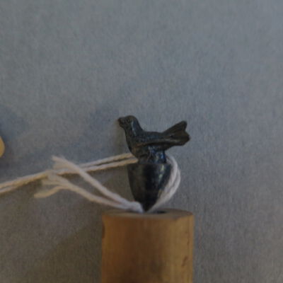 Close up of metal bird.: Origsize: 2" (h) x 0.5" (diam); Origformat: Artifact
