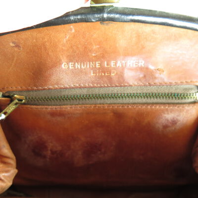 Inside of purse: Origsize: 22" (l) x 9" (w) x 3; Origformat: Artifact