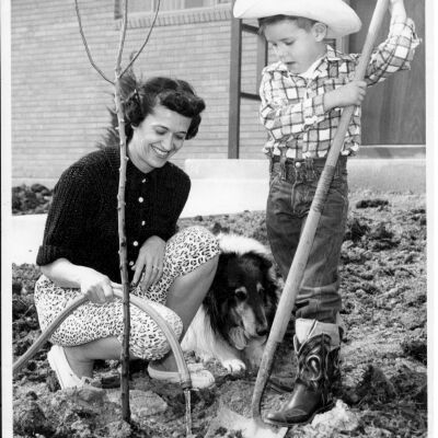 Young Boy and Woman Planting a Tree