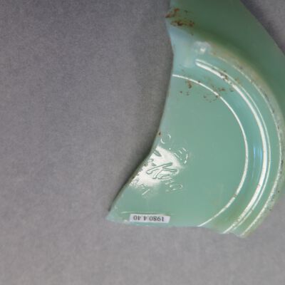Close up of text on dish fragment.: Origsize: .75" (h) x 2.75" (w); Origformat: Artifact