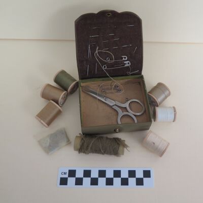 Inside of sewing kit: Origsize: 1.5" (h) x 3.75" (w); Origformat: Artifact