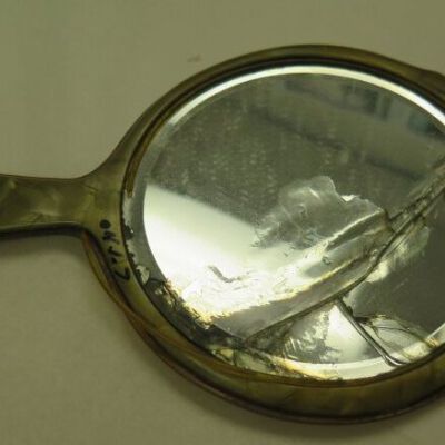 Front of mirror showing cracks: Origsize: 6" (w) x 10.5" (l); Origformat: Artifact