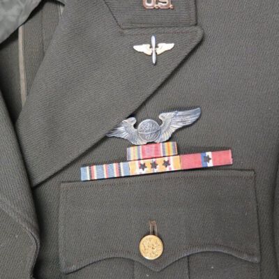 Close up of pins on front of jacket.: Origsize: 16" (w) x 31" (l); Origformat: Artifact