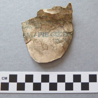 One side of cardboard scrap.: Origformat: Artifact