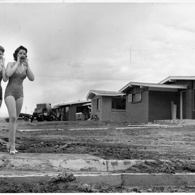 Two Ladies in Swimsuits at Construction Site