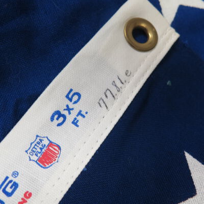 Close up of number on flag.: Origformat: Artifact