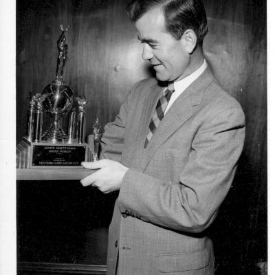 Mr. Casler Holding His Speach Award
