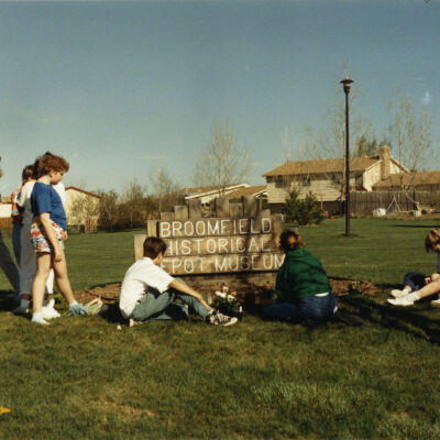 Kids Sitting by the Broomfield Historical Depot Museum Sign