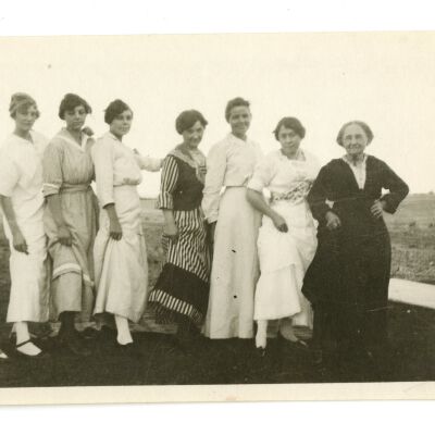 Ellenor Brown, Frances Cron, and Blanche Brown Posing with Others Outside