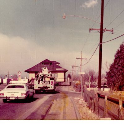 Broomfield Depot going down the street with cars behind