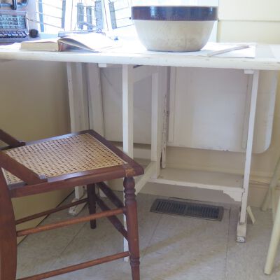 Side of table on exhibit.: Origsize: 29" (h) x 36" (w) x; Origformat: Artifact