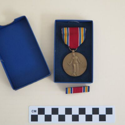 Medal inside of box: Origsize: 1" (h) x 2"(w) x 4"; Origformat: Artifact