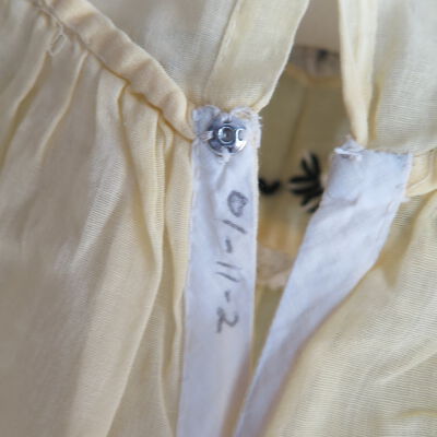 Number of dress: Origsize: 9" (w) x 18" (l); Origformat: Artifact