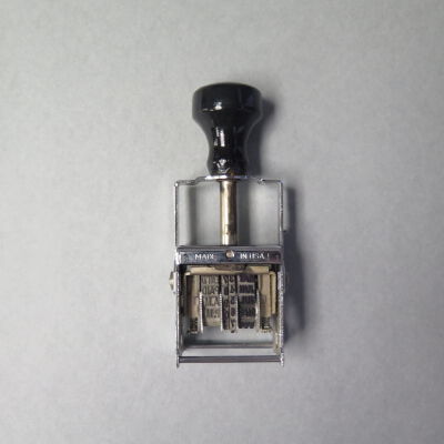 Back of date stamp.: Origformat: Artifact
