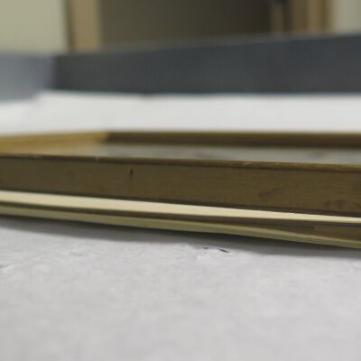 Condition: Frame separating from backing at top, side view (2018-08-31): Origformat: Artifact