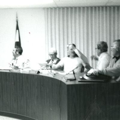 Men at City Council Meeting