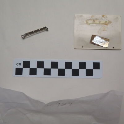 Back of nametag.: Origsize: 3" (w) x 2" (l); Origformat: Artifact