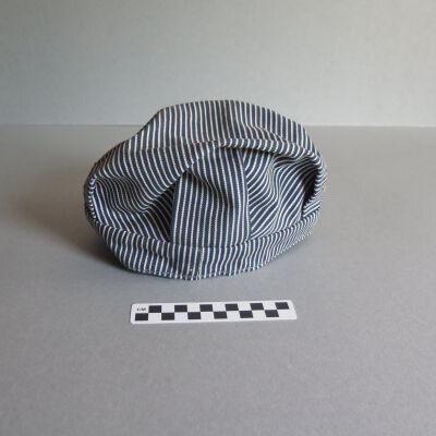 Back of hat.: Origsize: 6" (h) x 10" (w) x 1; Origformat: Artifact
