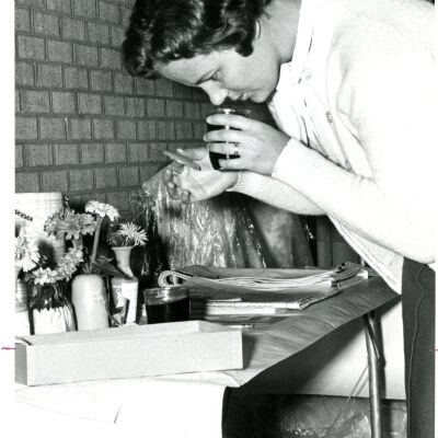 Woman Smelling Jar -- Jam? Captioned "Judge"