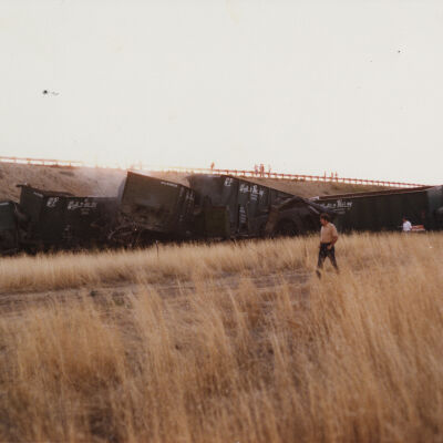 Two Men Walking Near the Train Wreckage of the US 36 Train Wreck